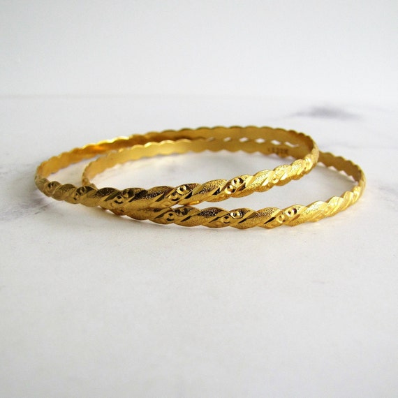 solid gold slave bangle