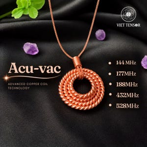 May include: A copper-colored wire coil pendant on a matching chain. The text reads Acu-vac, ADVANCED COPPER COIL TECHNOLOGY, VIET TENSOR, and a list of frequencies: 144 MHz, 177 MHz, 188 MHz, 432 MHz, and 528 MHz. Small purple stones are visible.