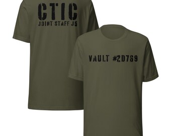 May include: Olive green t-shirts with black stenciled text. One shirt displays "CTIC JOINT STAFF J5" on the back. The other shirt shows "VAULT #2D769" on the front. The shirts have a crew neck and short sleeves.