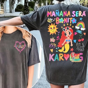 May include: A white ceramic mug with a black handle and the text "But First, Coffee" in a handwritten style. The mug is on a white surface. The mug is 4 inches tall.