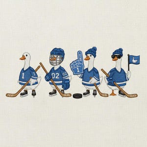 May include: Embroidered design featuring four geese in blue hockey jerseys and gear. Each goose holds a hockey stick, with one holding a foam finger and another a flag. The geese wear skates and helmets.