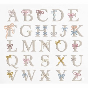 May include: An alphabet set featuring capital letters, each adorned with a delicate bow. The letters are in a neutral beige color, with bows in soft pastel shades of pink, blue, and yellow. The design is on a white background.