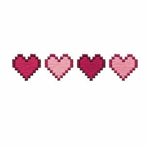 May include: Four pixelated heart designs in shades of pink and red are displayed on a white background. The hearts are embroidered with a retro video game aesthetic. The hearts are arranged horizontally, side by side.