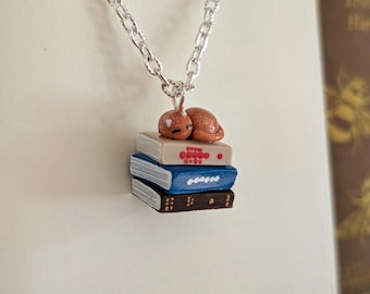 Ginger Cat on a Stack of Books Necklace 1.2x1.2cm by Coryographies