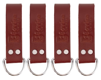 May include: Four identical dark red leather straps, each featuring a silver-toned metal D-ring at the bottom secured by two silver rivets. The leather is embossed with the text Bovino Leather, oriented vertically along the length of each strap.