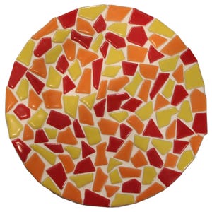 May include: A round mosaic piece with a white background and a colorful pattern. The mosaic features irregular shapes in shades of red, orange, and yellow. The piece is likely a decorative item, such as a trivet or coaster.