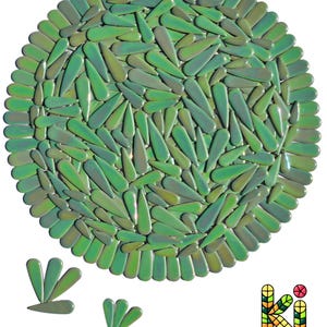 May include: A round, green decorative piece composed of numerous teardrop-shaped elements. The elements are arranged in a circular pattern, with a border of similar shapes. The piece has a glossy finish and varying shades of green. The logo "KI WEEZE" is in the bottom right corner.