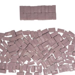 May include: A handmade, wooden cutting board with a natural finish. The board features a live edge, showcasing the wood's unique grain and shape. It is approximately 18 inches long and 12 inches wide.