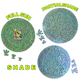 May include: Three circular plant mats with a mosaic design, each labeled with a different light condition: "FULL SUN", "PARTIAL SHADE", and "SHADE". The mats are green, iridescent, and blue, with the "Ki Weeze" logo.