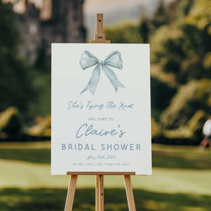Blue Bow Bridal Shower Welcome Sign, She’s Tying The Knot Dusty Blue Printable Poster, Wedding Shower Decor, Bachelorette Welcome Sign