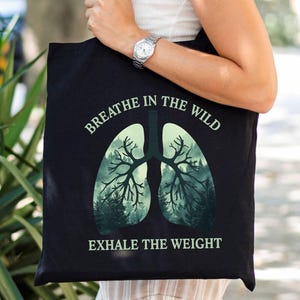 Inspirational Black Cotton Canvas Tote Bag "Breathe in the Wild - Exhale the Weight", forest lovers, fresh air, hiking adventure