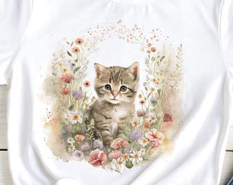 May include: White t-shirt featuring a watercolor illustration of a kitten surrounded by flowers. The shirt is paired with blue jeans and floral print shoes. The t-shirt is knotted at the waist.