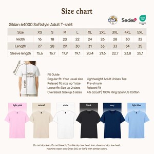 May include: A size chart for Gildan 64000 Softstyle Adult T-shirts. The chart includes measurements for width, length, and sleeve length in inches. The chart also shows the fit guide and available colours: light pink, natural, white, black, navy, and light blue.