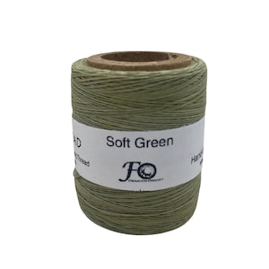 May include: A spool of soft green waxed thread for hand sewing. The label reads "Soft Green" and features a logo with the letters "FO".