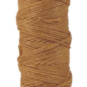May include: A spool of tan waxed linen thread.