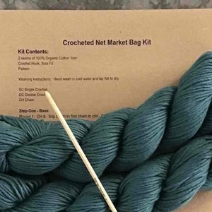 May include: Crocheted Net Market Bag Kit with two skeins of teal organic cotton yarn, a crochet hook, and instructions for making a crocheted net market bag.