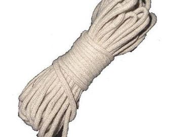 May include: A close-up of a white cotton cord, coiled and ready for use. The cord is soft and pliable, perfect for crafting or other projects.