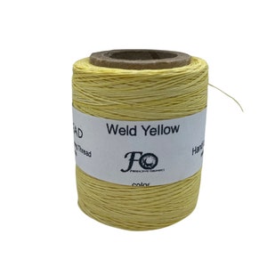 May include: A spool of yellow waxed thread labelled "Weld Yellow" with the brand name "FO" printed on the label.