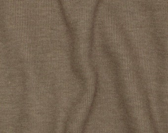 May include: Close-up of a brown ribbed fabric with a subtle texture. The fabric has a smooth, soft feel and a slightly wrinkled appearance.