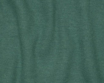 May include: A close-up of a textured, green fabric with a subtle ribbed pattern.