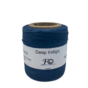 May include: A spool of deep indigo waxed linen thread. The label reads "Deep Indigo" and "FO Fabrications Originals".