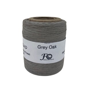 May include: A spool of Grey Oak waxed thread for hand sewing. The spool is labelled "Grey Oak" and has the logo "FO Craftsmen Originals".