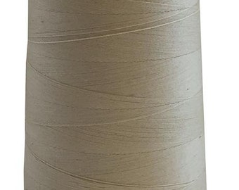 May include: A spool of beige thread.