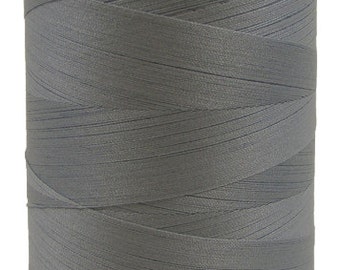 May include: A spool of light gray thread.