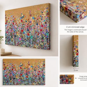May include: A rectangular canvas wall art piece featuring a vibrant, multi-coloured floral meadow design against a gold background. The artwork includes a 2 cm mirrored edge where the painted design continues around the sides of the canvas frame.