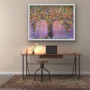 May include: A rectangular framed wall art piece featuring a vibrant, multi-coloured tree with a dense canopy of dots in shades of pink, yellow, blue, green, and orange, set against a soft purple background with a dark, textured tree trunk.