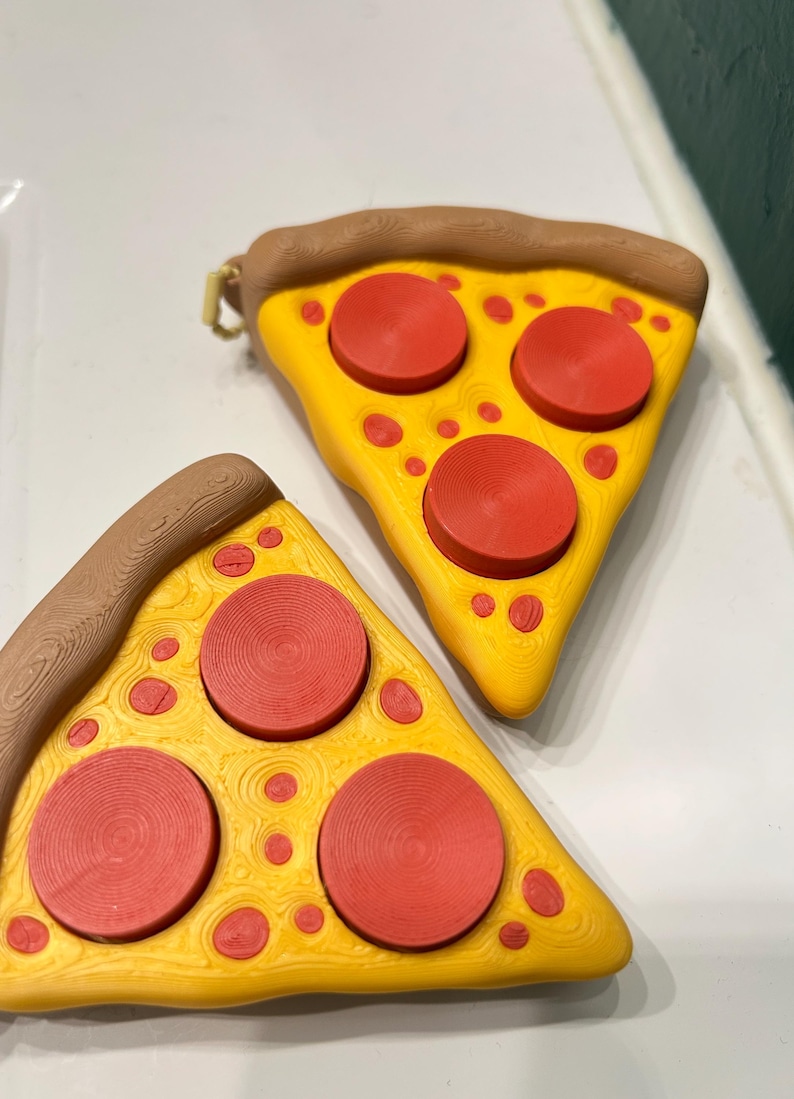 Juguete antiestrés con clicker y forma de rebanada de pizza imagen 4