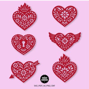 May include: Six red heart-shaped designs with intricate floral patterns. One heart has a keyhole, another has wings, and one is pierced by an arrow. The image includes the text "Marca Chancho" and file type options: SVG, PDF, AI, PNG, and DXF.