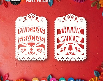 May include: Two white Papel Picado tags with decorative cut-out designs. One tag says "Muchas Gracias" and the other says "Thank You". The tags are on a red background with colorful paper flowers. The image also includes the text "Instant Download".