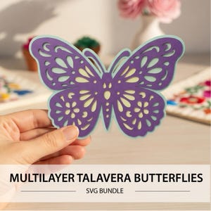 May include: A multilayer butterfly cutout featuring a deep purple top layer with intricate filigree patterns and a light mint green bottom layer. The text MULTILAYER TALAVERA BUTTERFLIES SVG BUNDLE is printed at the bottom of the image.