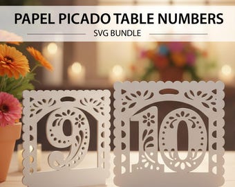 May include: White laser-cut table number decorations with scalloped edges. The numbers 9 and 10 are displayed in a decorative font with floral cutouts. The text "PAPEL PICADO TABLE NUMBERS SVG BUNDLE" is at the top.
