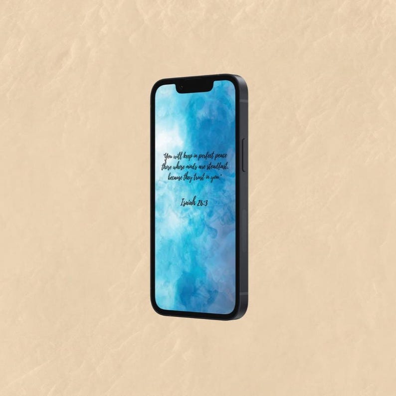 May include: A black smartphone displays a blue and white abstract background with the text "You will keep in perfect peace those whose minds are steadfast, because they trust in you. Isaiah 26:3."