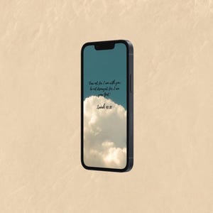 May include: Black smartphone displaying a wallpaper with a cloudy sky and text from Isaiah 41:10: "Fear not, for I am with you; be not dismayed, for I am your God."