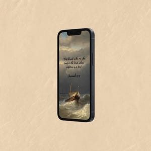 May include: A black smartphone displays a digital artwork of a ship at sea during a storm. The artwork includes a quote from Jeremiah 17:7: "But blessed is the one who trusts in the Lord, whose confidence is in him."
