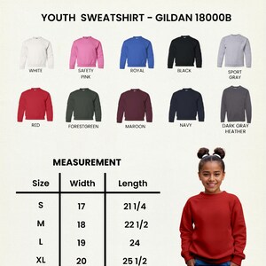 May include: A youth sweatshirt in various colors, including white, pink, royal blue, and black. The image displays a size chart with measurements in inches and a young person wearing a red sweatshirt. The text reads "YOUTH SWEATSHIRT - GILDAN 18000B."