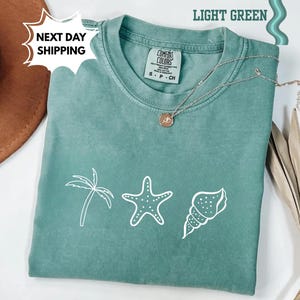Camiseta de conchas marinas de los 90 con estilo vintage de Comfort Colors®, camiseta retro Y2K con conchas marinas, camiseta para amantes del mar, camisetas de verano con océano, camiseta con animales marinos adorables