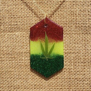 Weed Leaf Necklace: Rasta Stripe Real Weed Pot Leaf Red Yellow & Green Pigment Background Hexagon Shaped Pendant with Gold Plated Chain