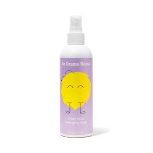 May include: A white spray bottle with a purple label. The label reads "No Drama Mama" and "Chase Away Detangling Spray." A yellow cartoon character is on the label. The bottle contains 237 ml of product.