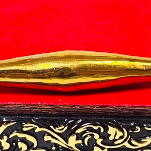 Golden Leklai Amulet: Wealth & Protection Talisman - Buffalo Mountain Cave