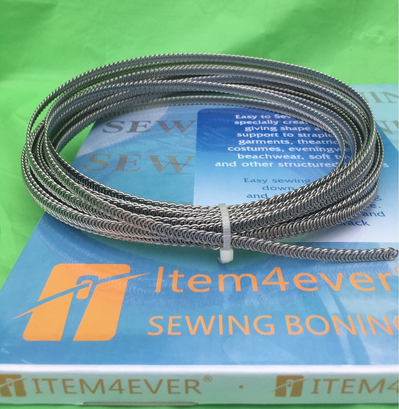 May include: A roll of silver-colored metal boning for sewing, with the text "SEW" printed on the packaging. The packaging also features the text "Item4ever Sewing Boning" and the logo "Item4ever".