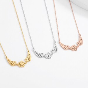 May include: A set of three ceramic mugs with a speckled, matte finish. The mugs are in shades of cream, light gray, and dark gray. Each mug has a simple, minimalist design and a rounded handle.