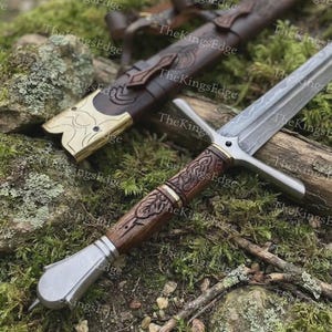 May include: A double-edged sword with a patterned steel blade, a crossguard, and a dark brown wooden handle featuring carved leaf motifs. The sword includes a matching dark brown leather scabbard with brass accents and intricate engravings.