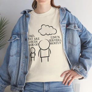 May include: Cream-colored t-shirt with a humorous graphic. The design features a cloud, stick figures, and the text: "Dad, what are clouds made of?" and "Linux servers, mostly."