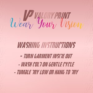 May include: A pink graphic with the text VP VALORY PRINT Wear Your Vision and washing instructions: turn garment inside out, wash cold on gentle cycle, tumble dry low or hang to dry. The background features a repeating VP logo pattern.