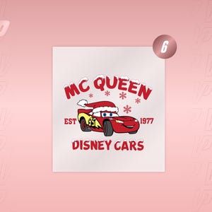 May include: A graphic print featuring Lightning McQueen from Disney Cars wearing a red Santa hat. The text reads MC QUEEN, EST 1977, and DISNEY CARS, accented with red snowflakes and snow-covered lettering on a white background.