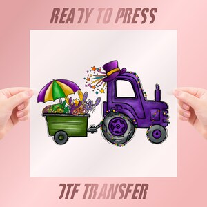 May include: A purple tractor with a green trailer, decorated with a top hat, beads, and fireworks. The trailer holds a colorful umbrella and crawfish. The words "READY TO PRESS" and "DTF TRANSFER" are displayed.